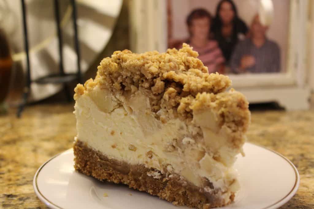 popular dessert recipes apple crumble cheesecake on a plate