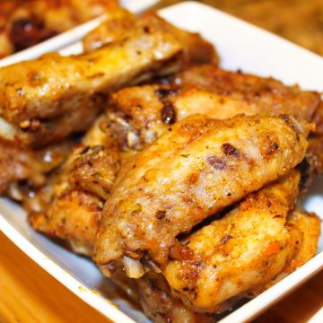 roasted chicken wings in a white plate