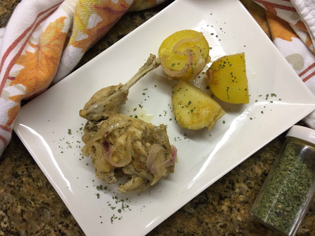 Italian Braised Rabbit Recipe and potatoes in a white dish