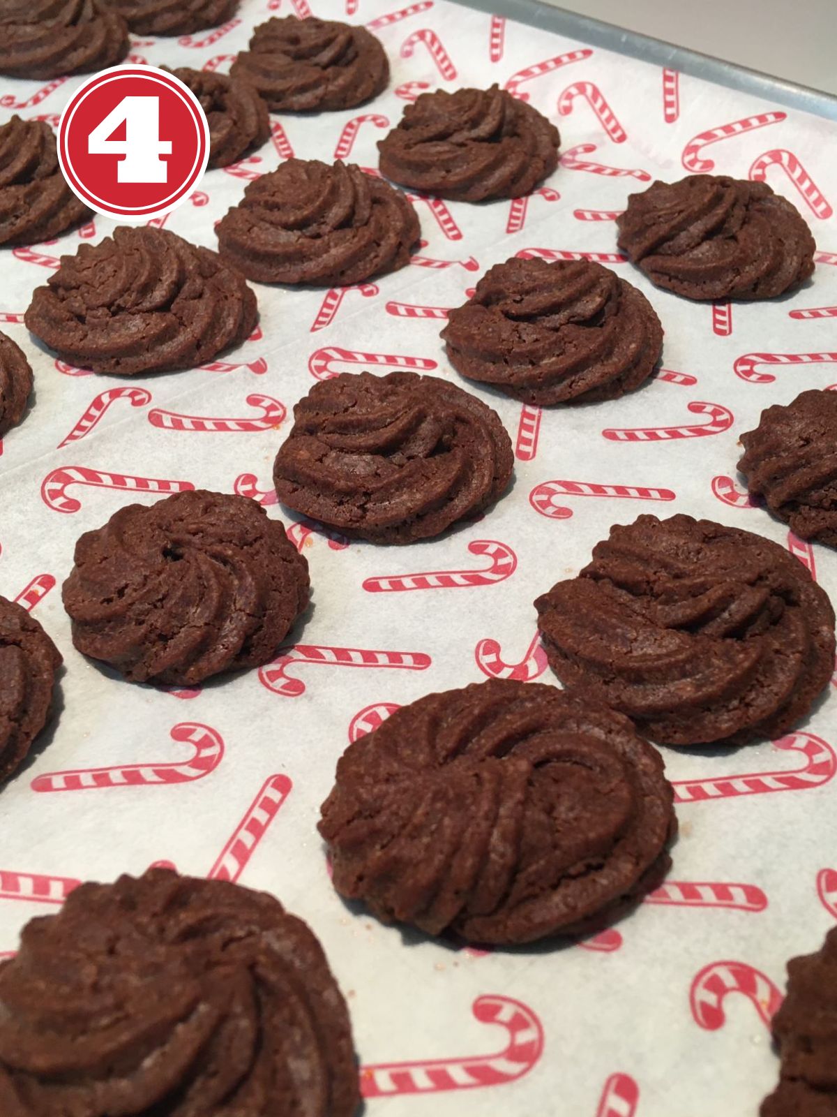baked nutella cookies on a baking tray with parchment papaer