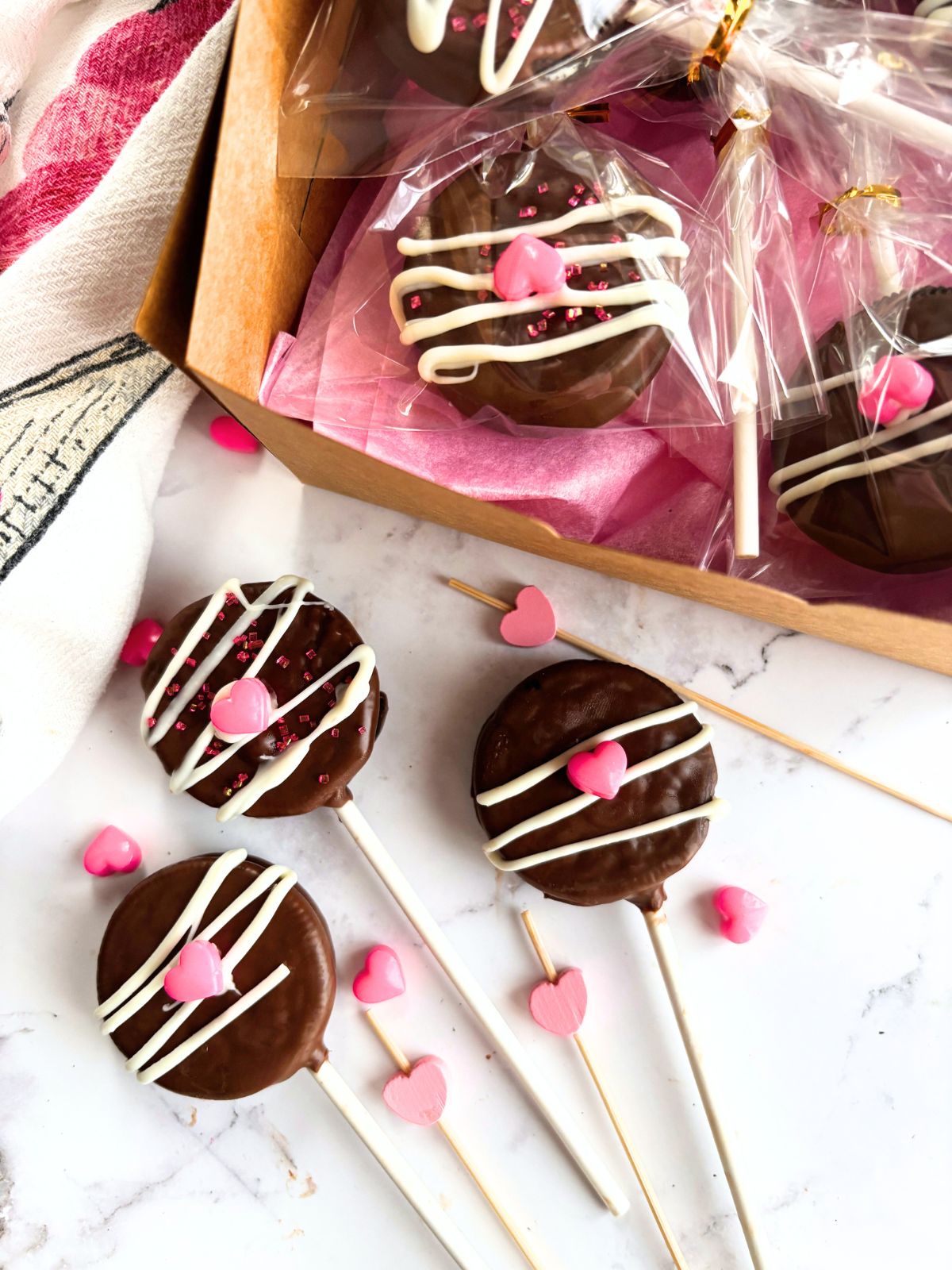 cookie pops on the counter next to packaged cookie pops