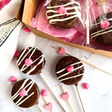 cookie pops on the counter next to packaged cookie pops