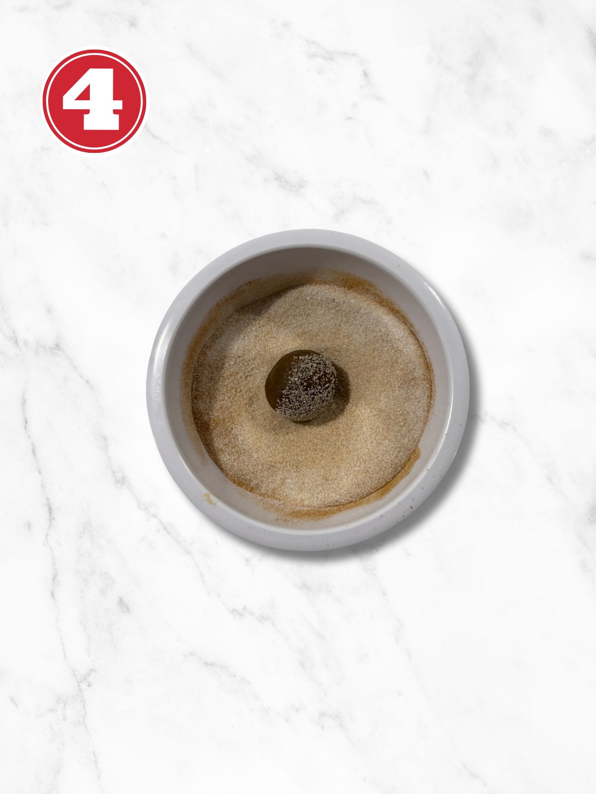 rolled raw cookie in sugar cinnamon