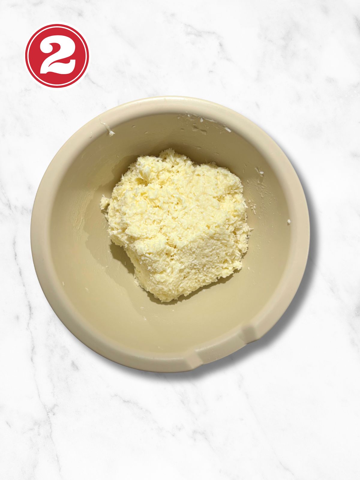 coconut macaroon batter in a beige bowl