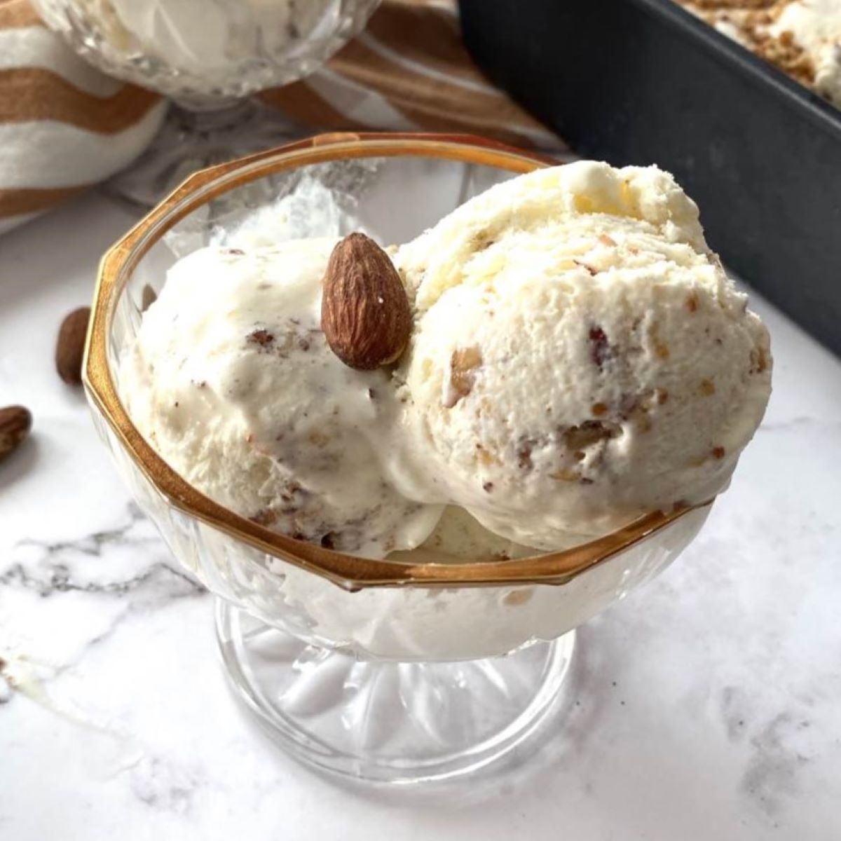 Torrone ice cream in a gold plated ice cream bowl