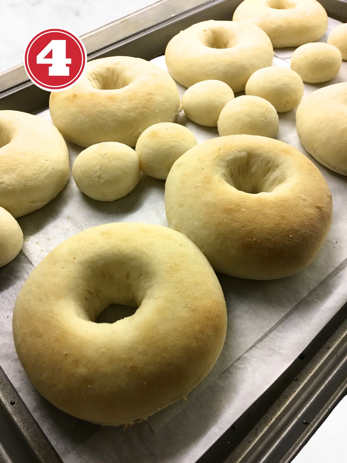 baked donuts up close on a baking sheet