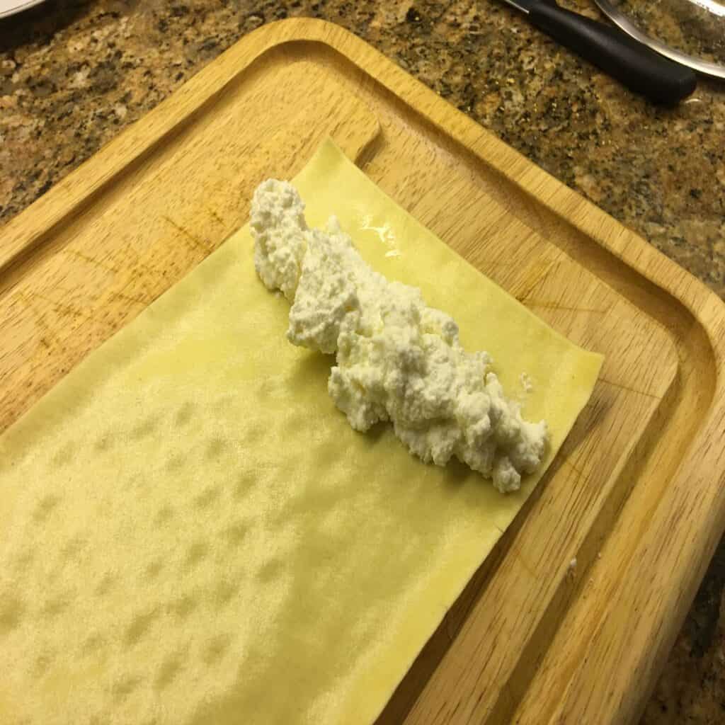 Cheese filling on a lasagna sheet