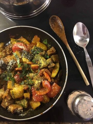 eggplant and zucchini in a frypan on stove