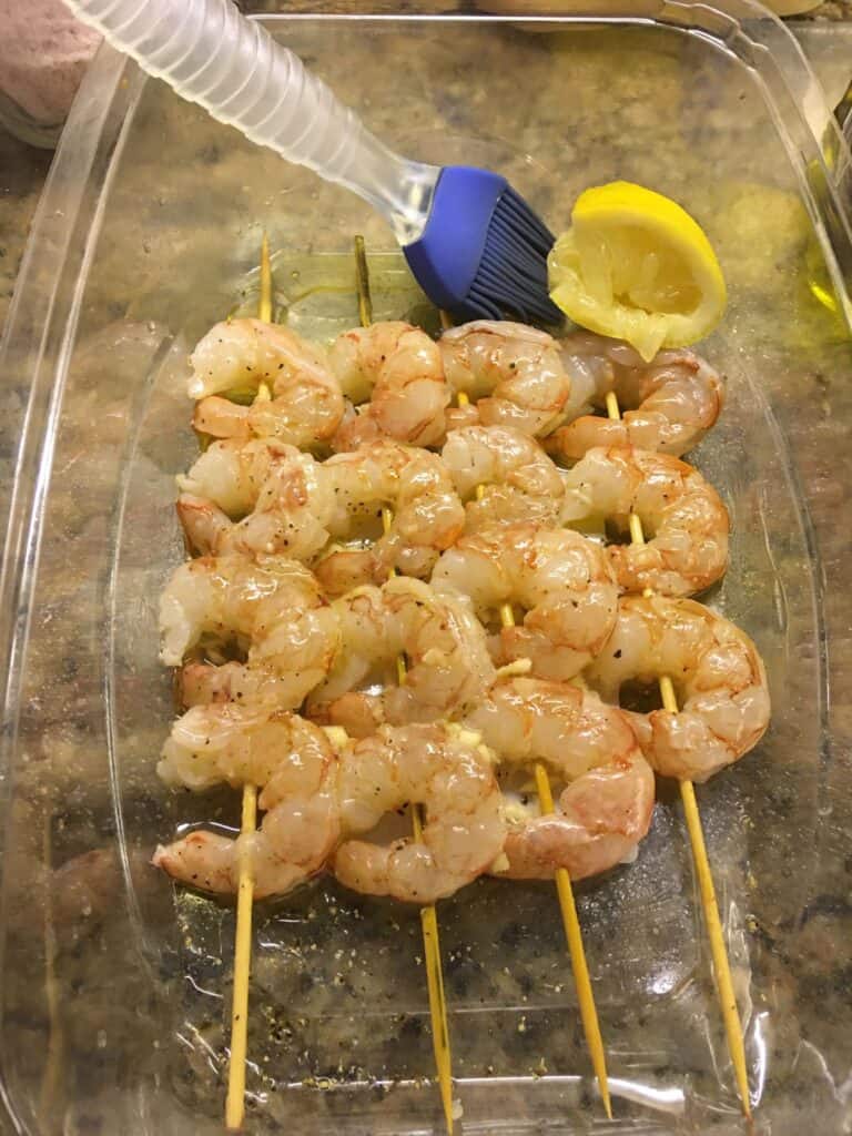 Shrimp on skewers marinating