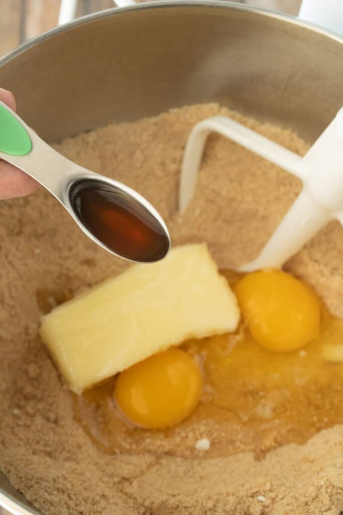 bater in food processor adding eggs and butter