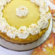 Decorated Pumpkin Cheesecake on a white plate