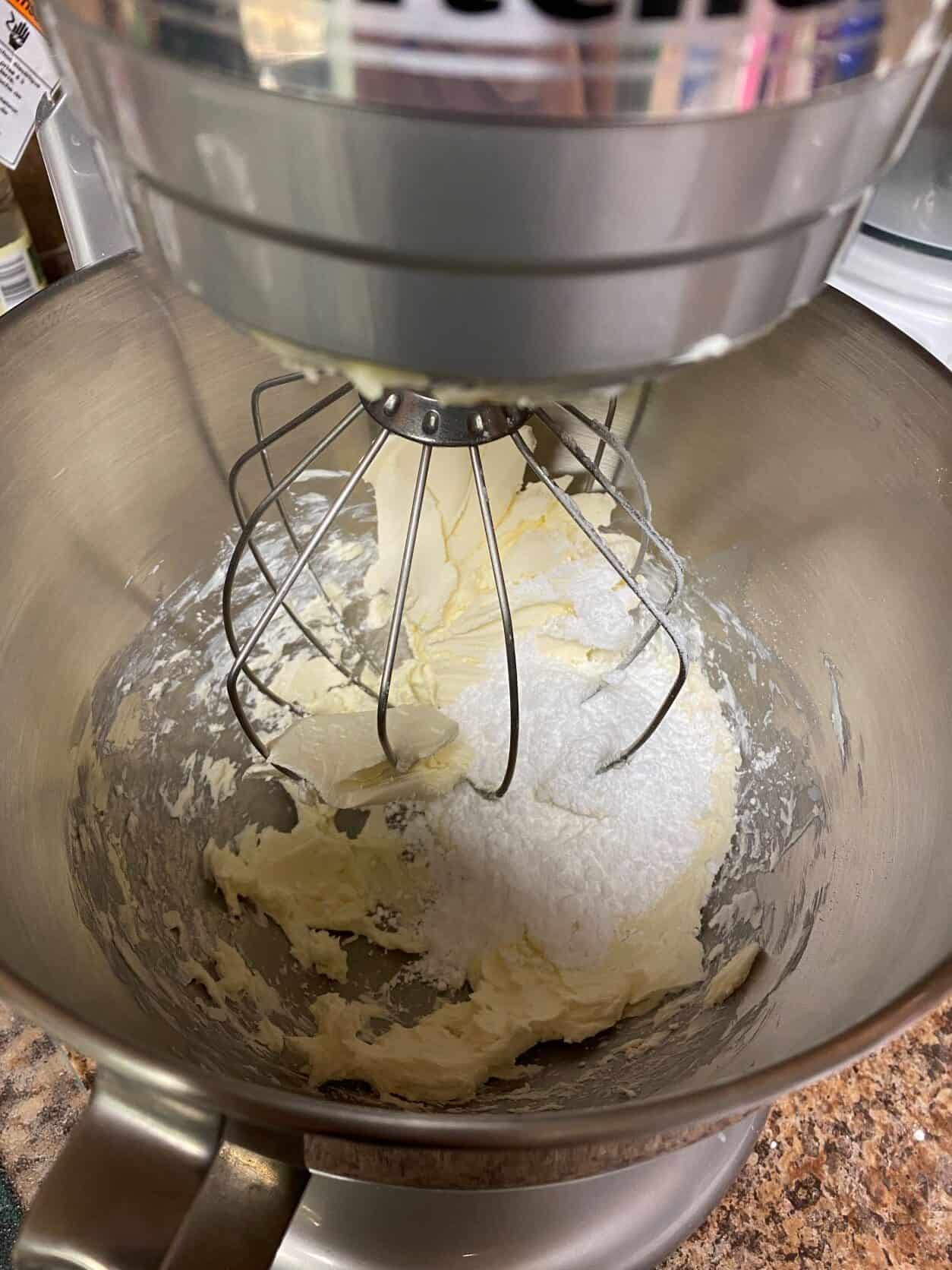 Cream cheese and powdered sugar in a mixing bowl