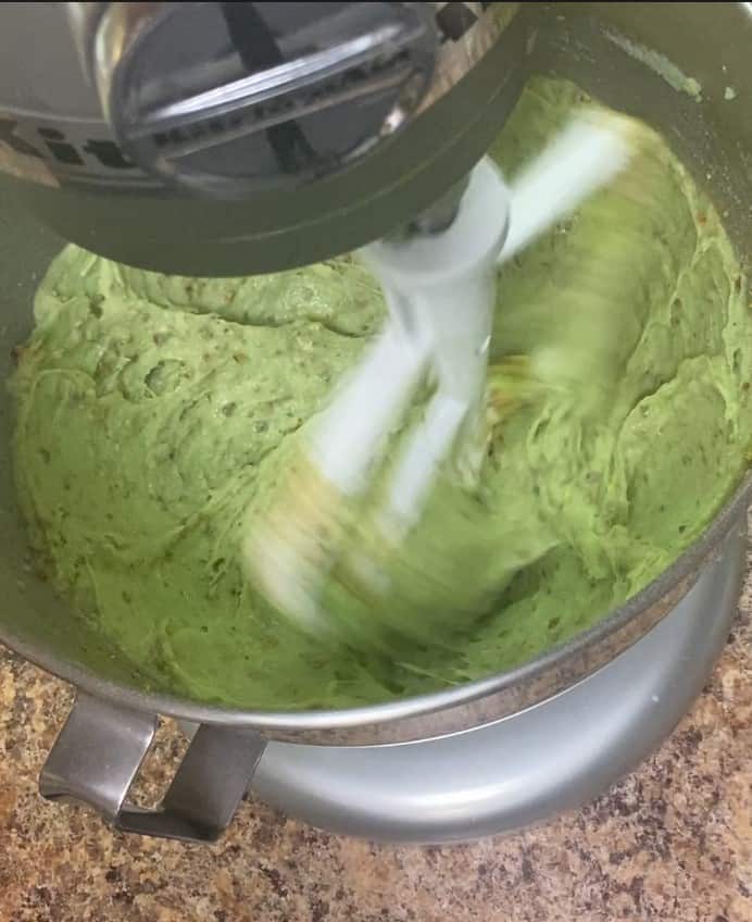 pistachio bundt cake batter in a mixer