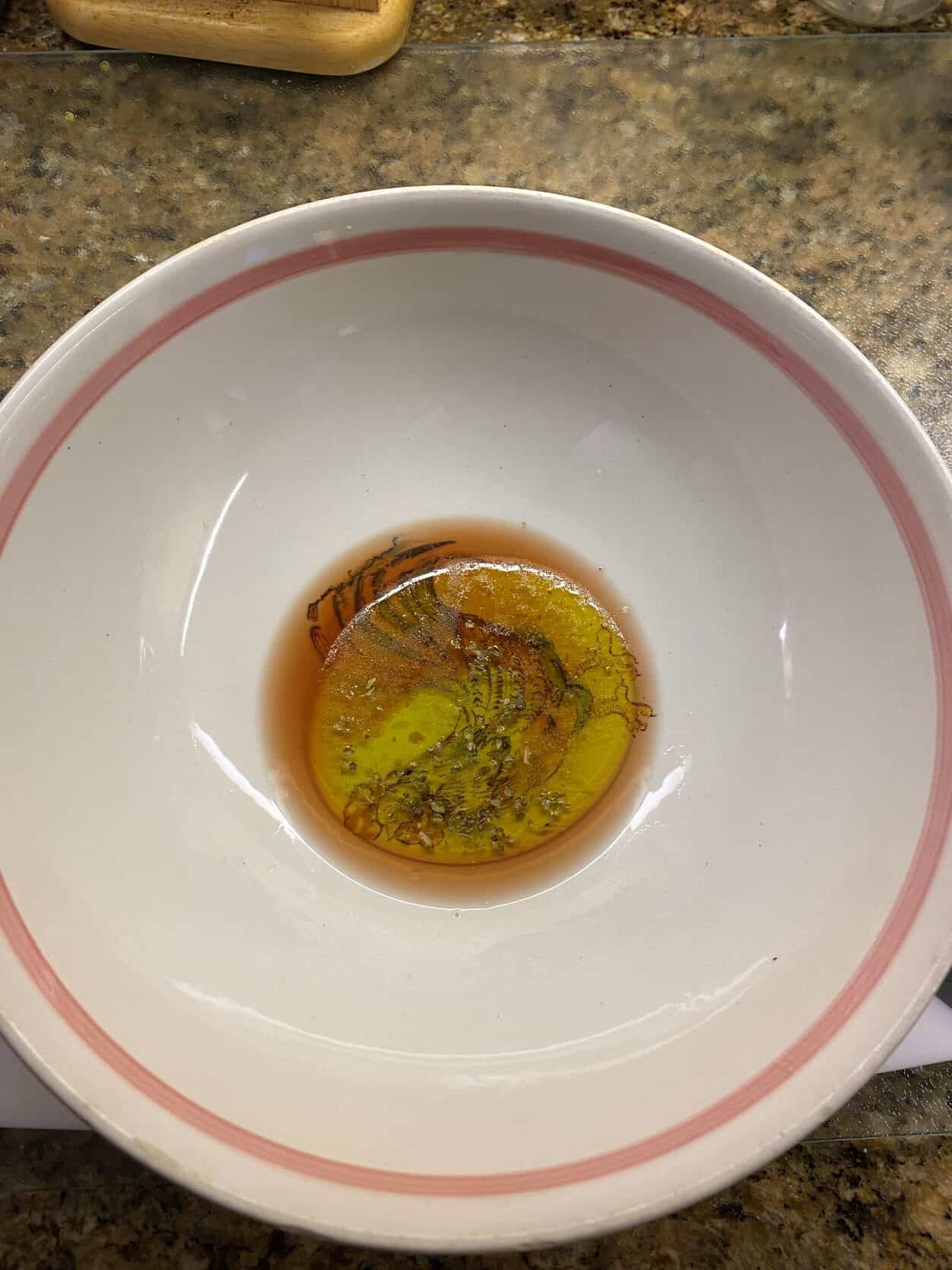 Oil Vinegar Salt and Oregano in a Salad Bowl