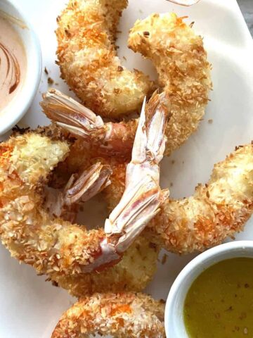 Coconut shrimp with Dipping Sauce in a white plate