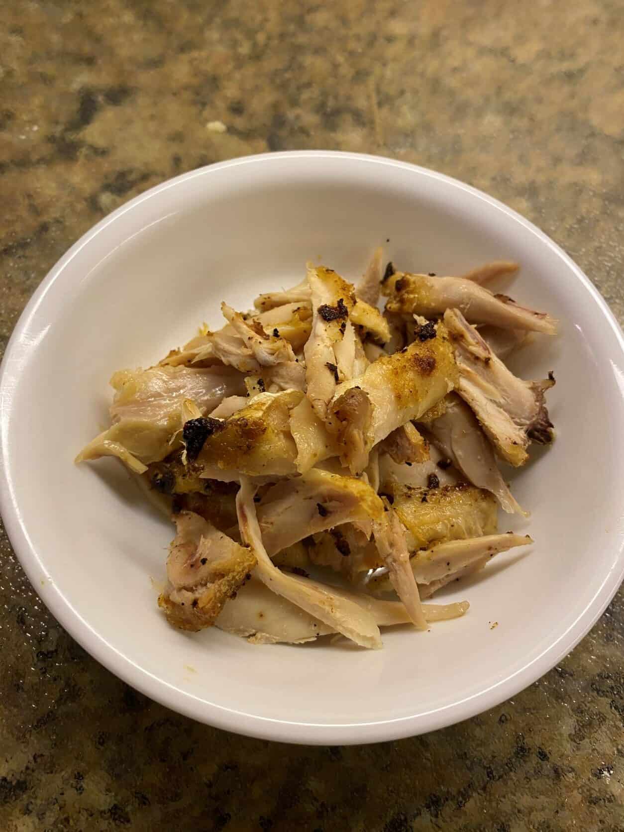 roasted chicken shredded in a small white bowl