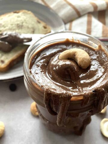 Cashew butter with chocolate in a glass ja