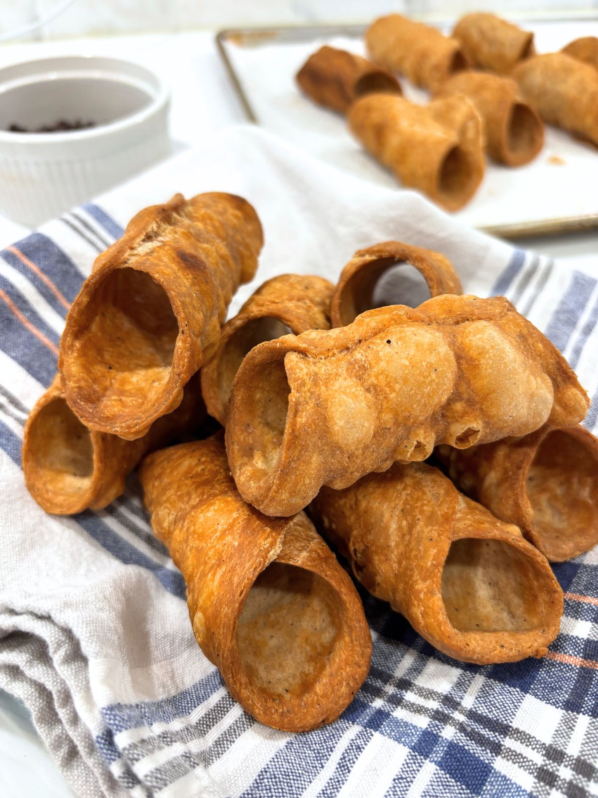 Empty Cannoli Shells on a Kitchen towel