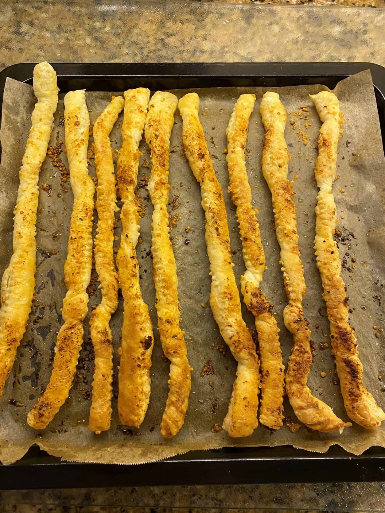 baked Garlic Bread Sticks on a baking tray