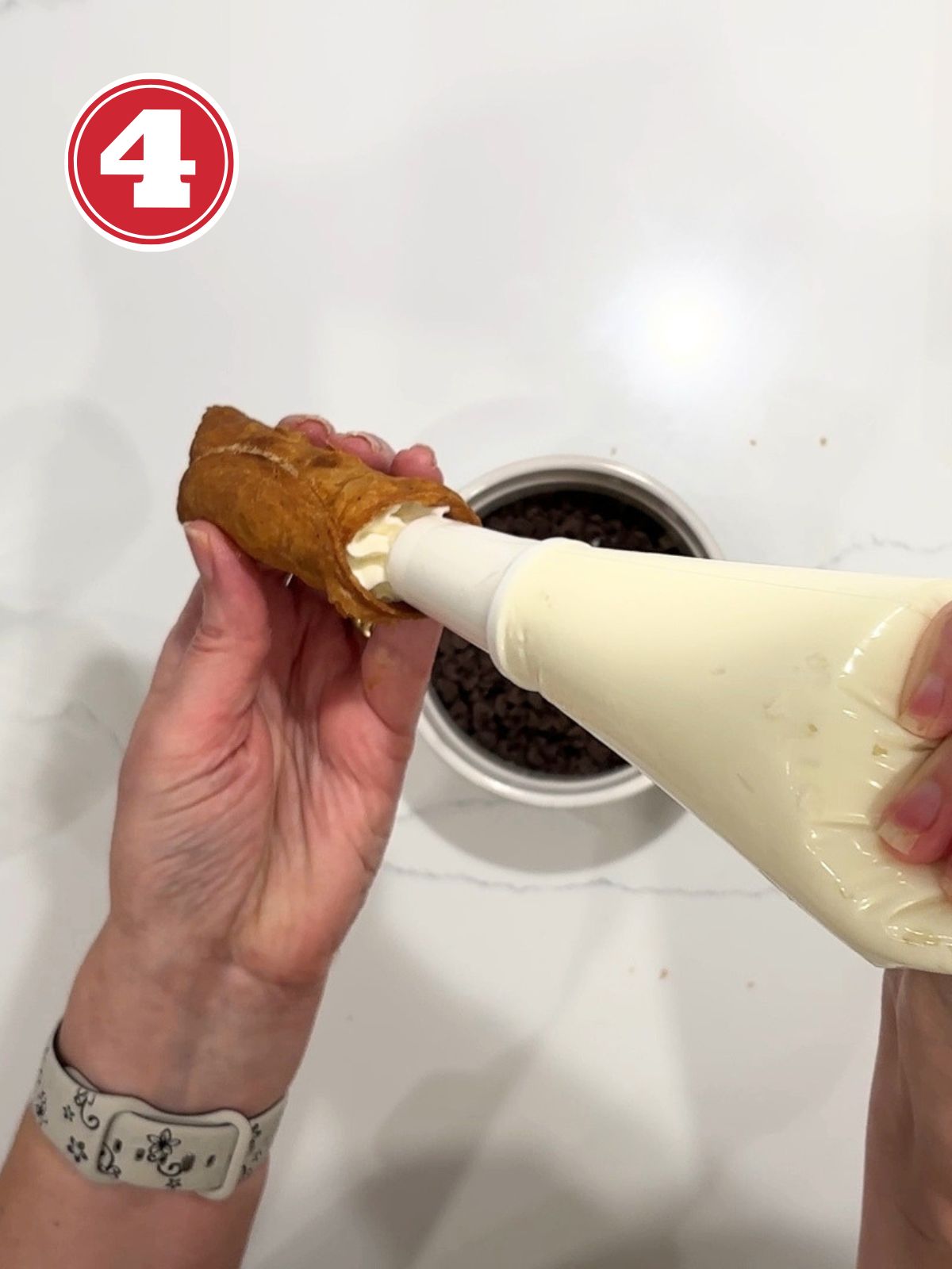 filling italian cannoli with ricotta cream filling