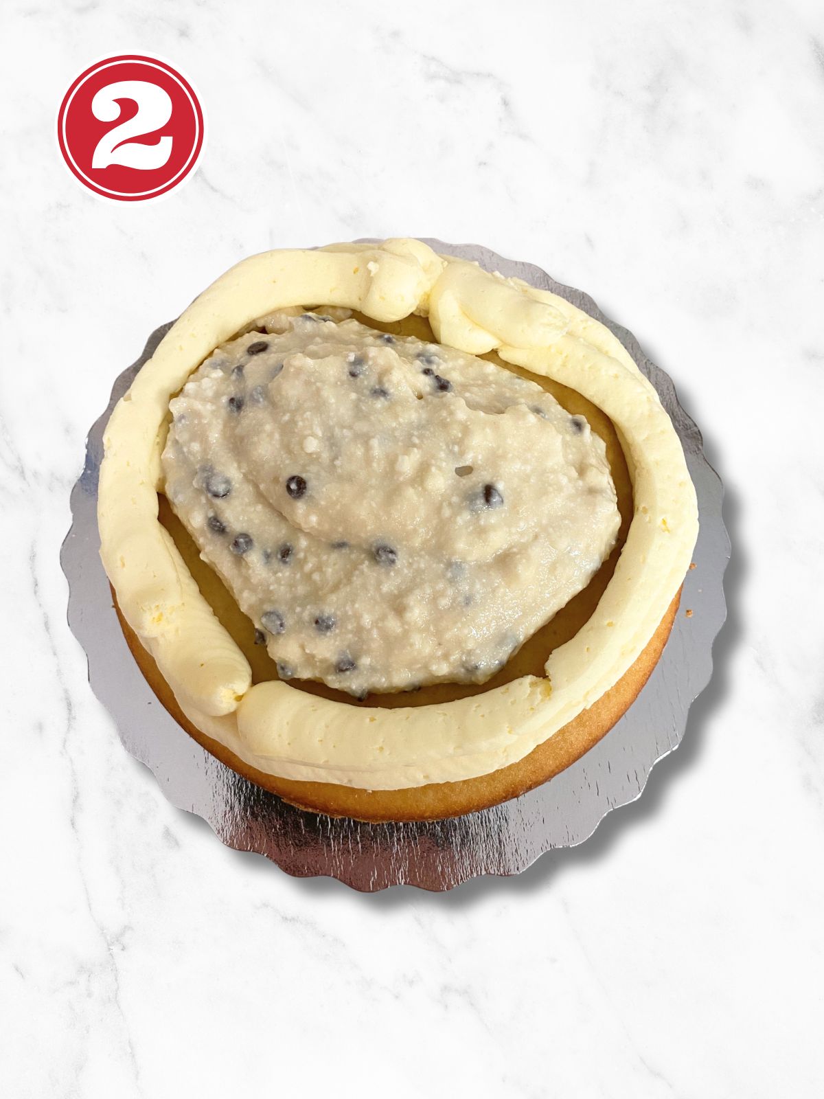 first layer of vanilla cake with cannoli filling