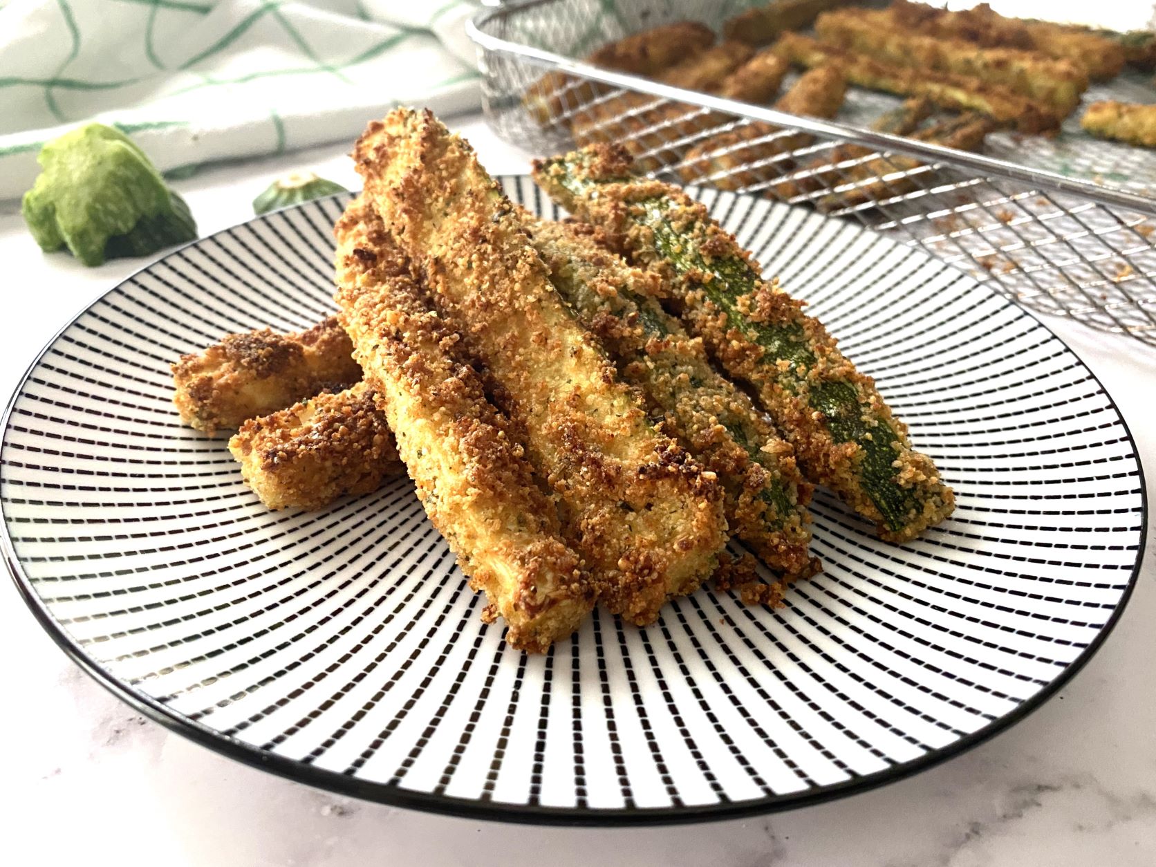 Air Fried Zucchini in a black and white plate