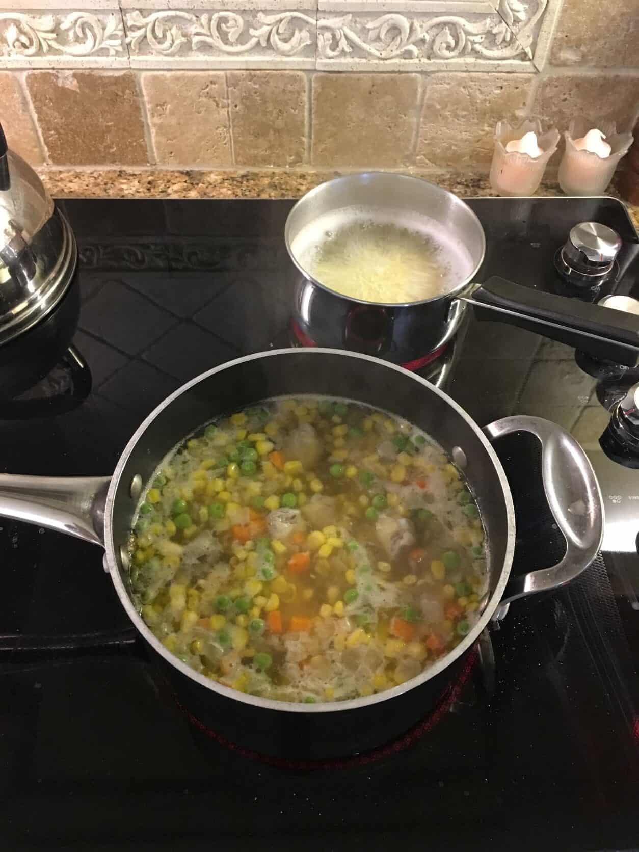 Chicken Soup with Corn in a stock pot