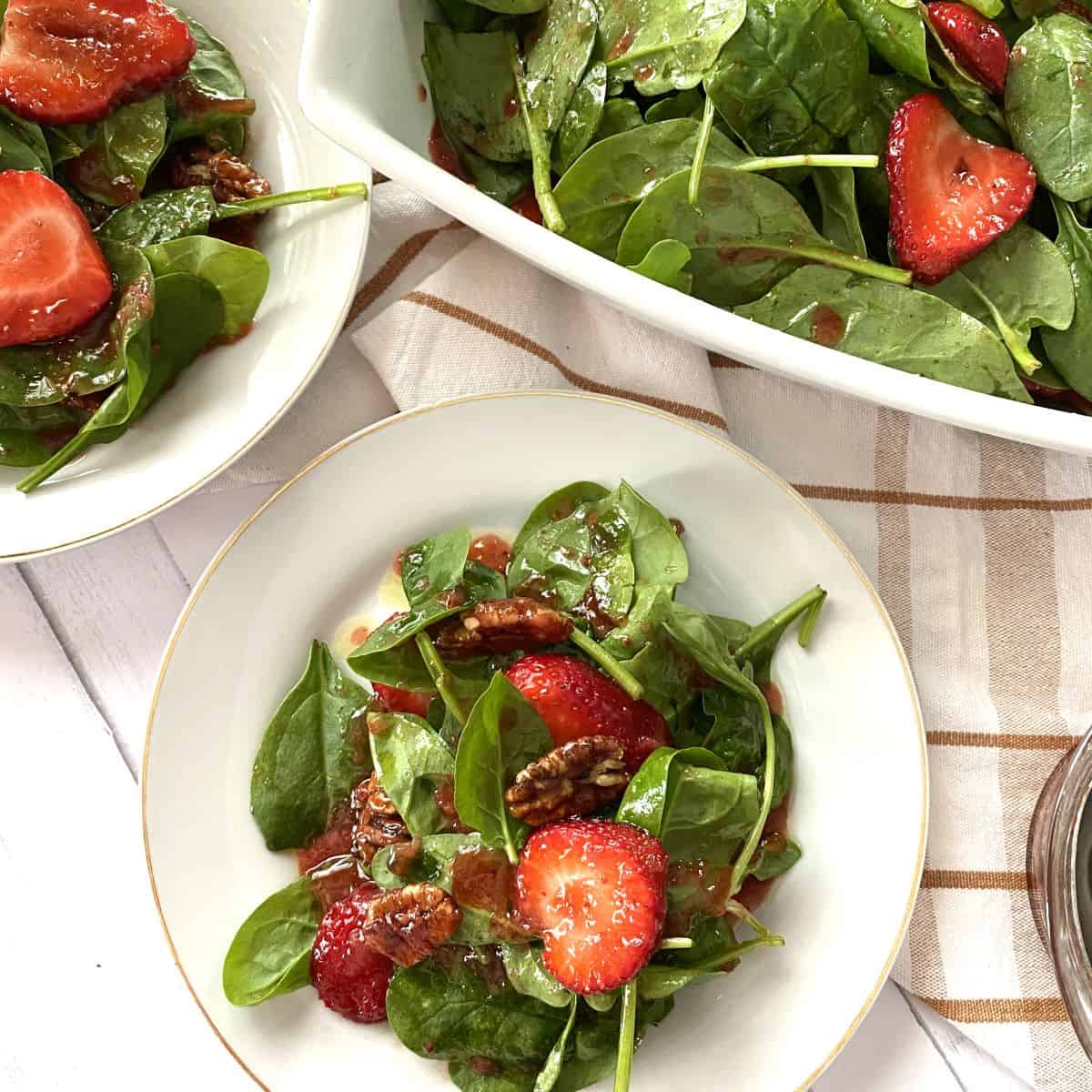 Spinach Strawberry Salad in white plates