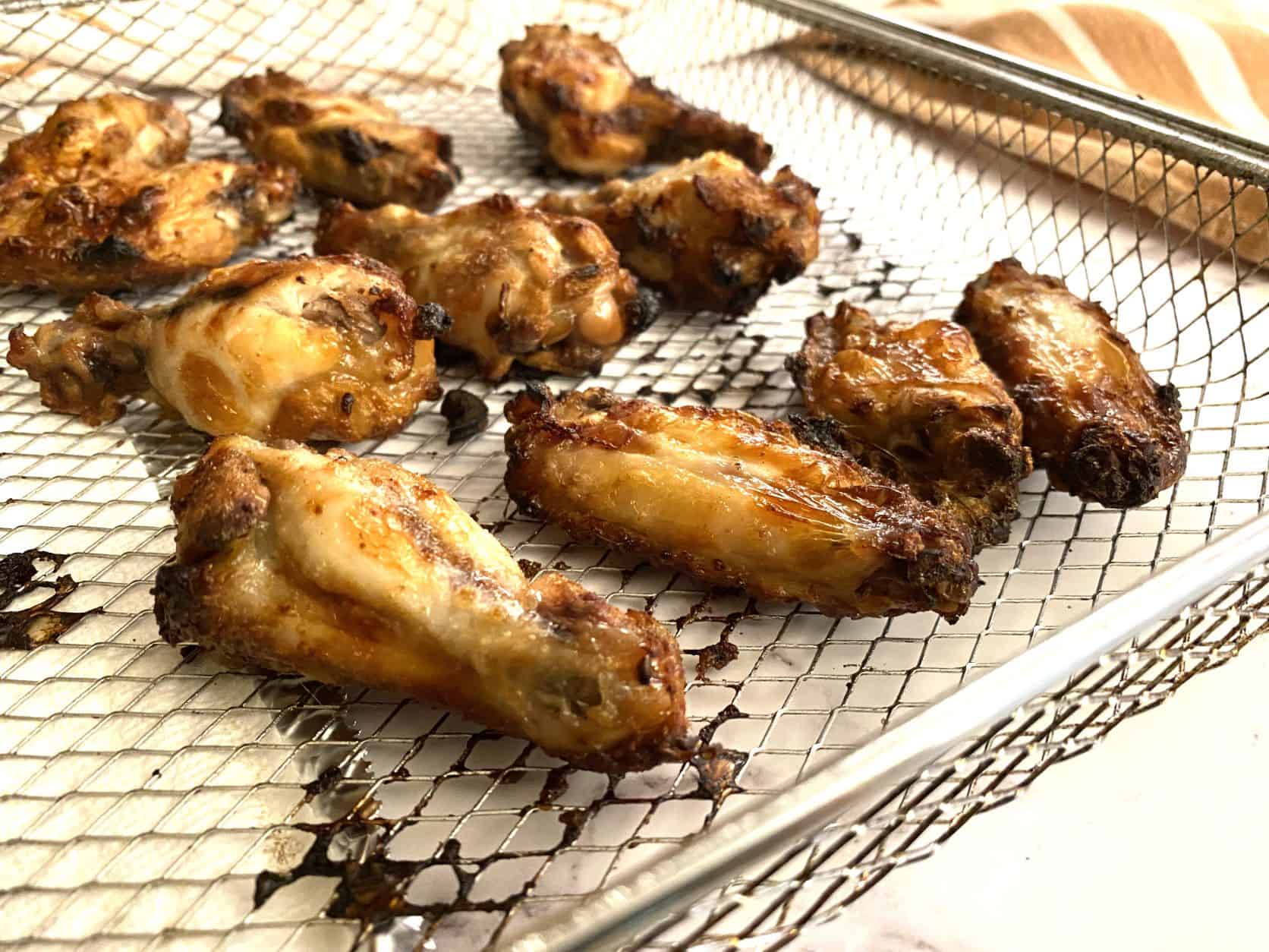Brined chicken wings in a wire basket