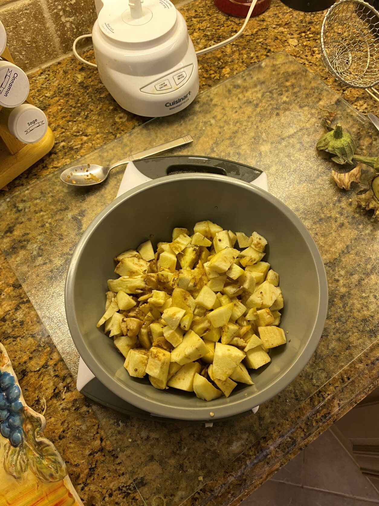diced, boiled eggplant in a grey bowl