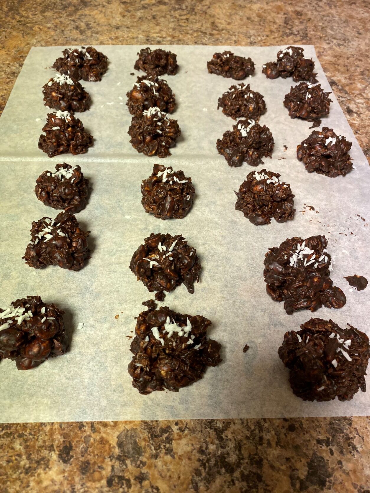 chocolate clusters drying on parchment paper