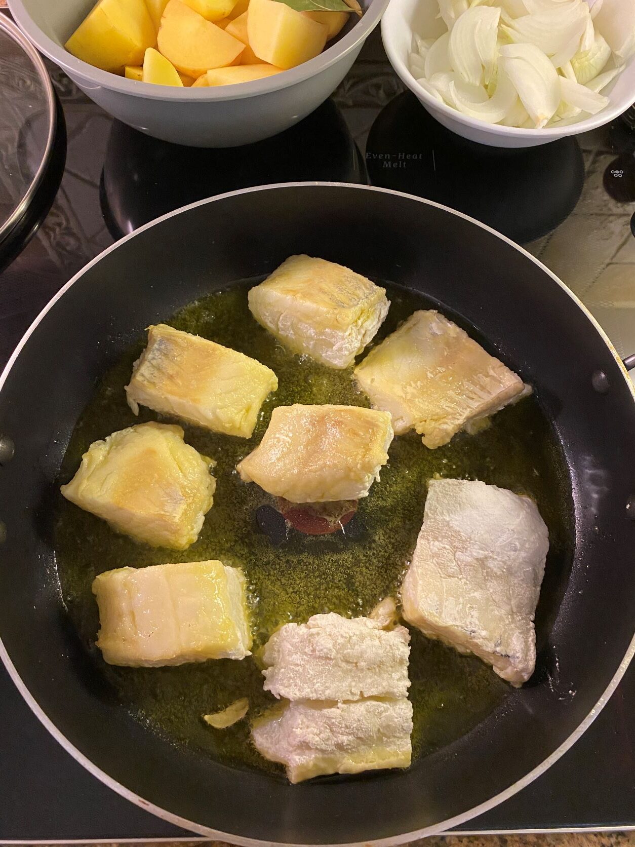 salted cod in a frying in a frypan