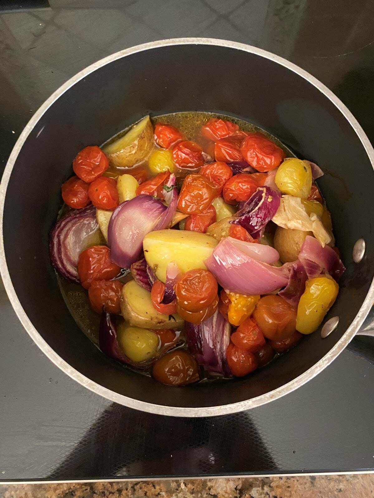 Cherry Tomatoes and potatoes garlic in pot