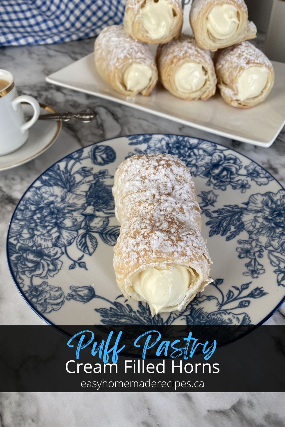 puff pastry cream horn in a blue and white saucer PIN
