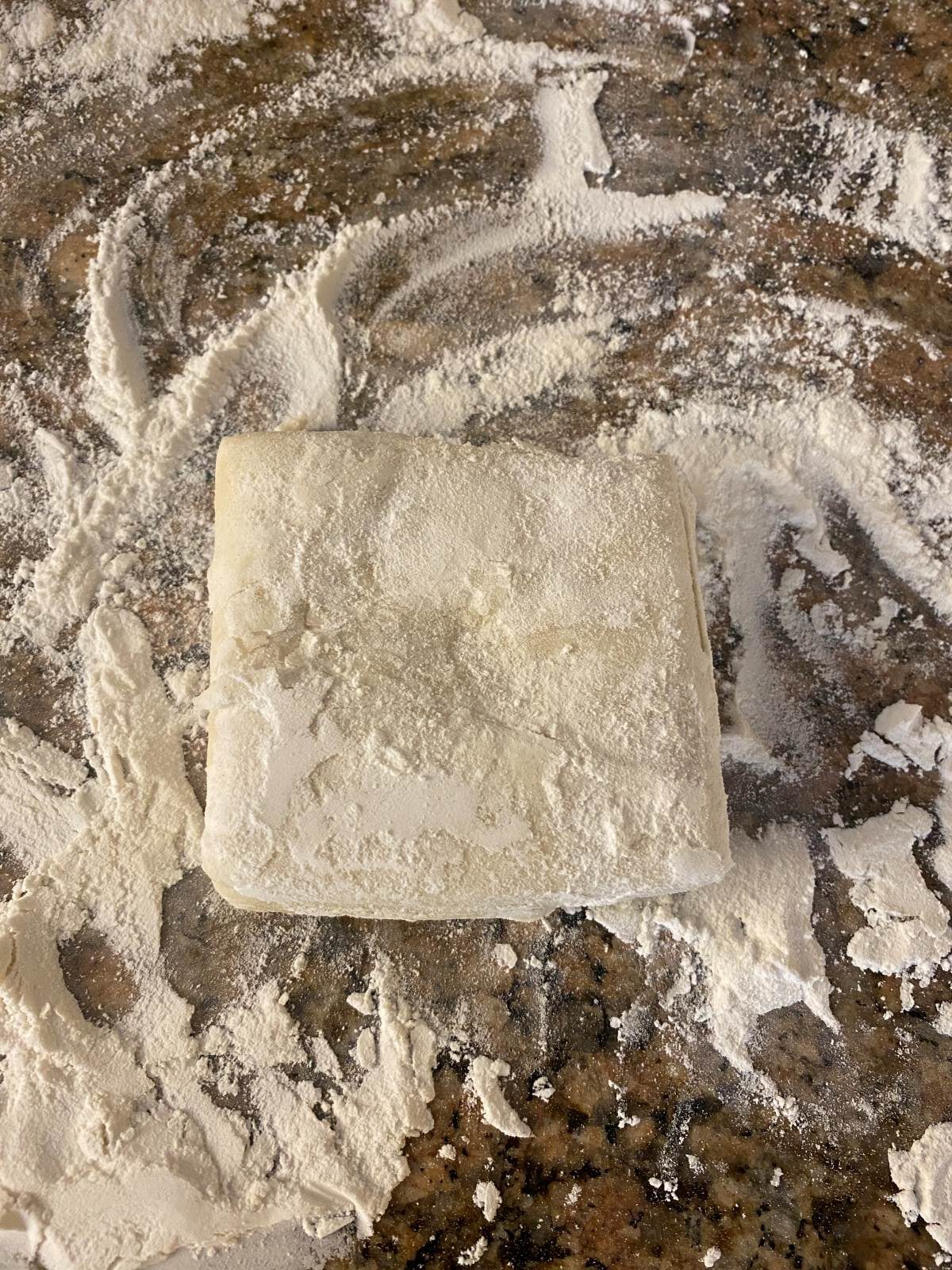 Puff Pastry on a floured granite counter top