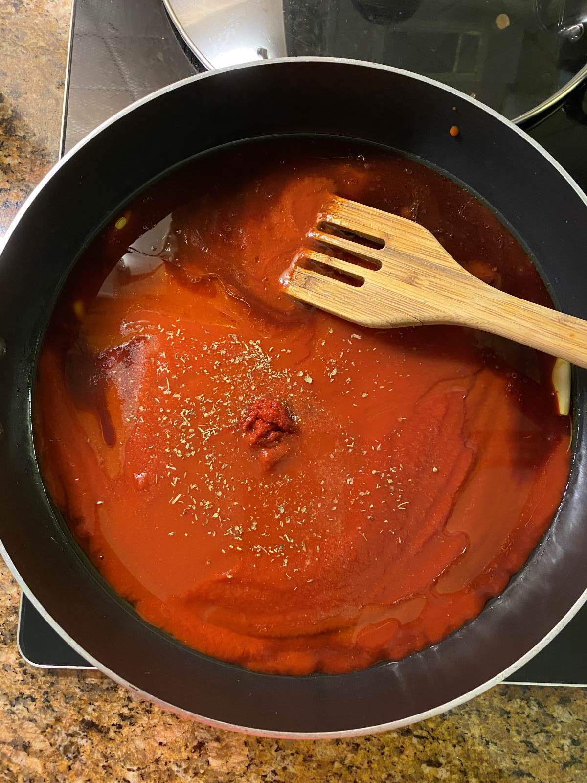 red wine tomato sauce in a large saute pan