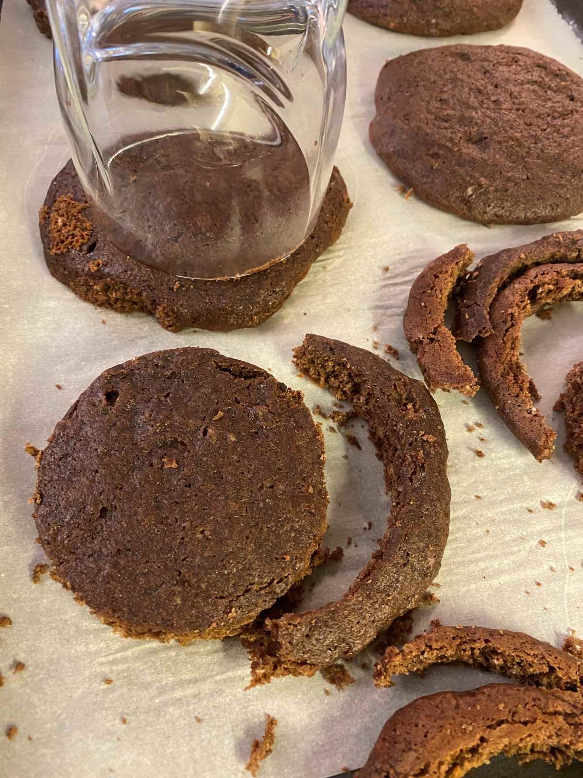 Glass tumbler making round mold of chocolate cake cookie