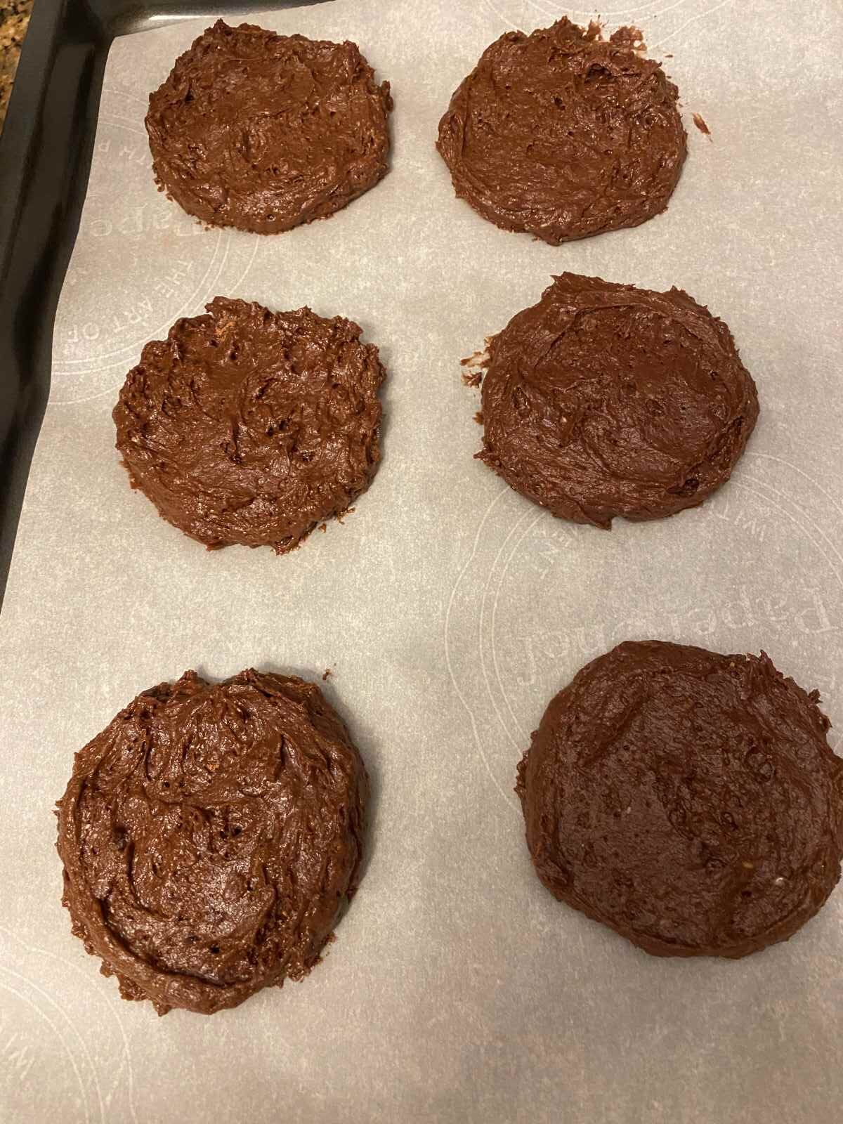 uncooked chocolate cake cookies on a baking tray