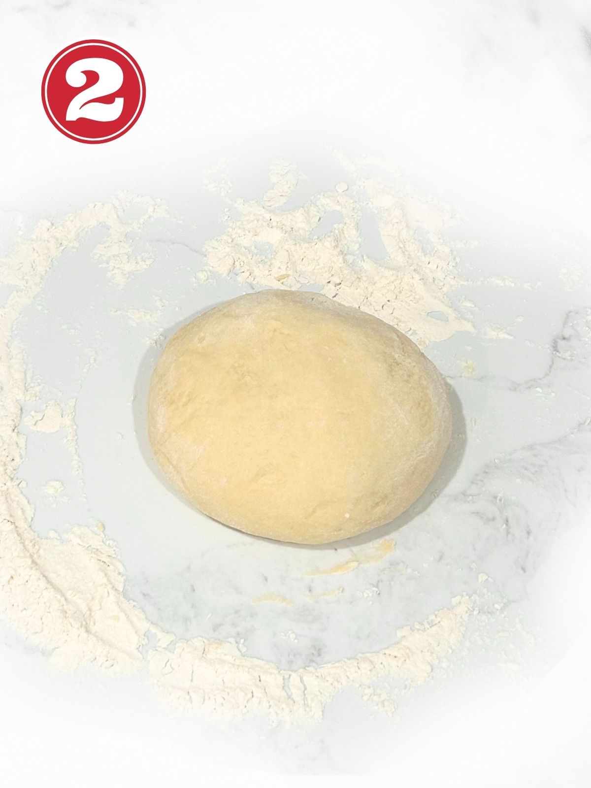 dough resting on a floured surface