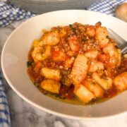 Potato Gnocchi in a white plate with meat sauce