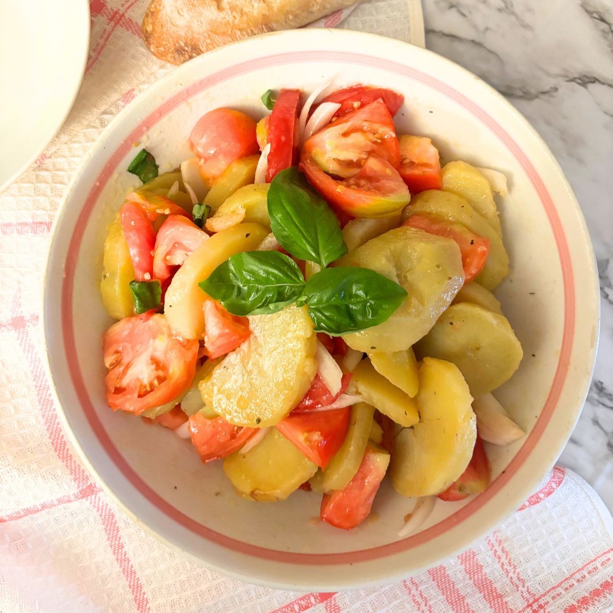 Potato salad in a white bowl