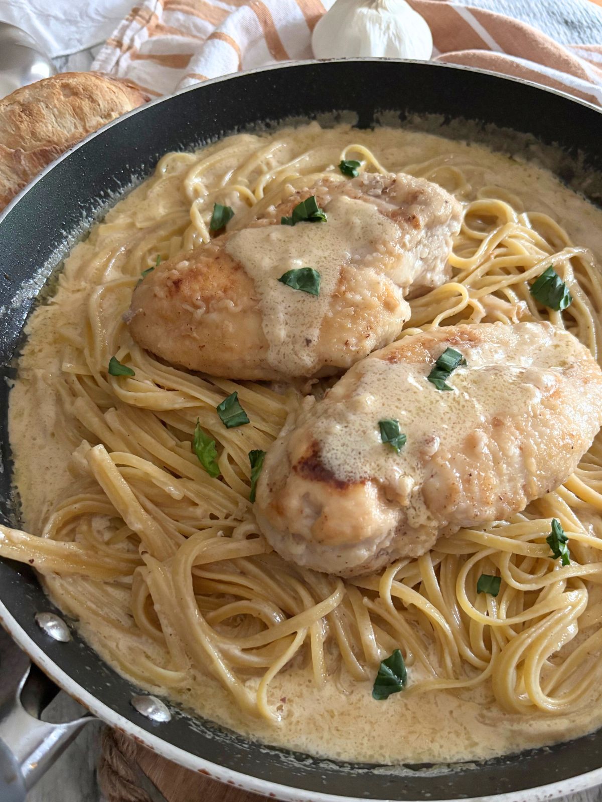 garlic parmesan chicken pasta in a skillet