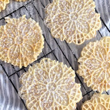 Pizzelle cookies with anise on cooling rack
