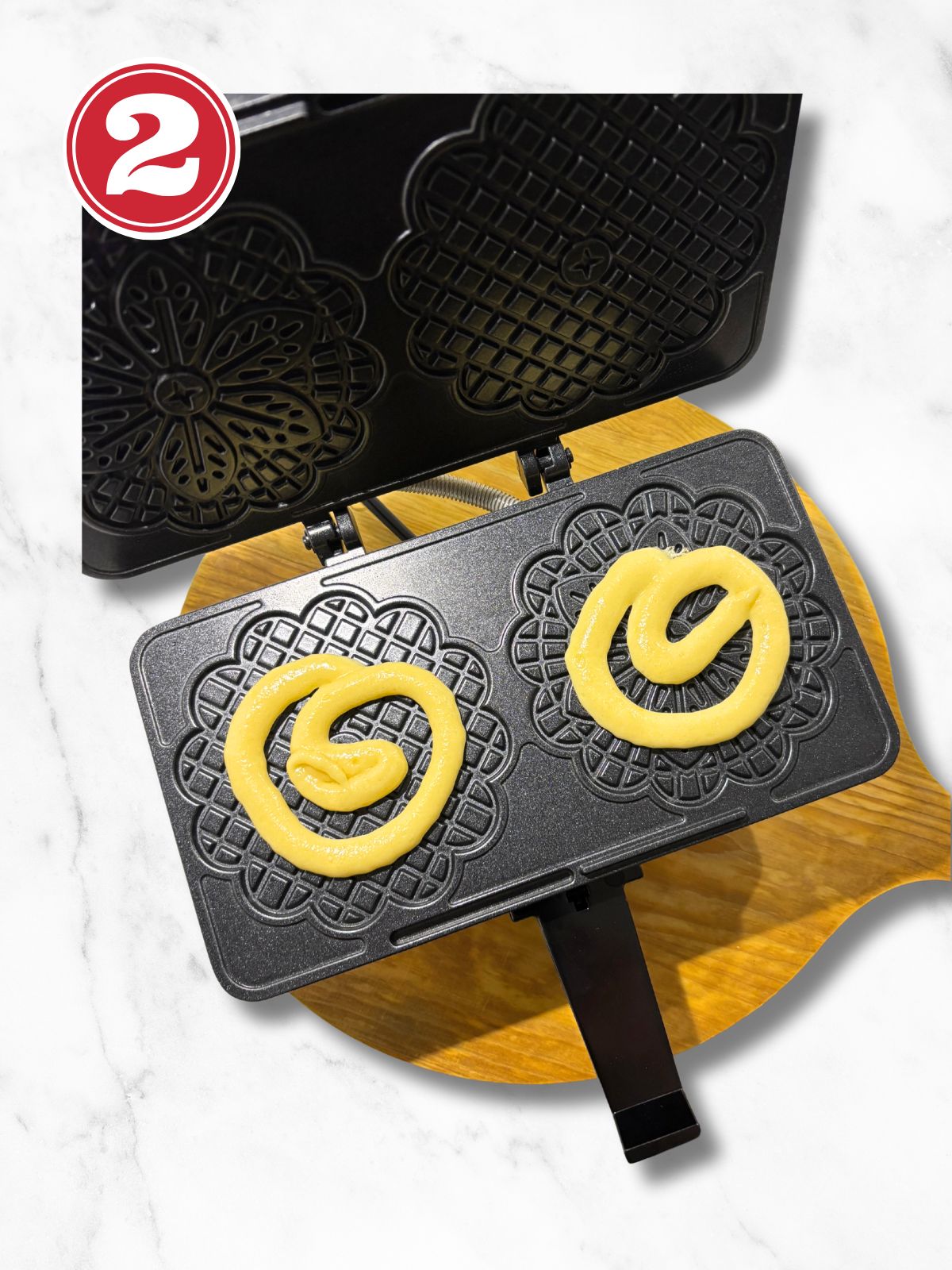 pizzelle dough in pizzelle iron