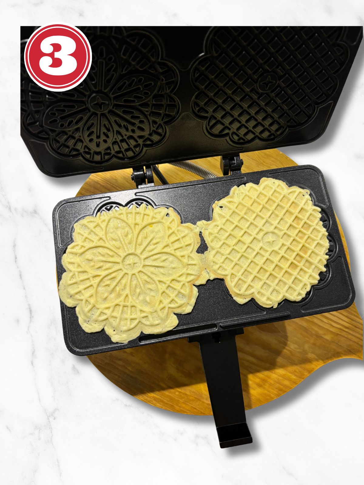 anise pizzelle cookies in pizzelle iron