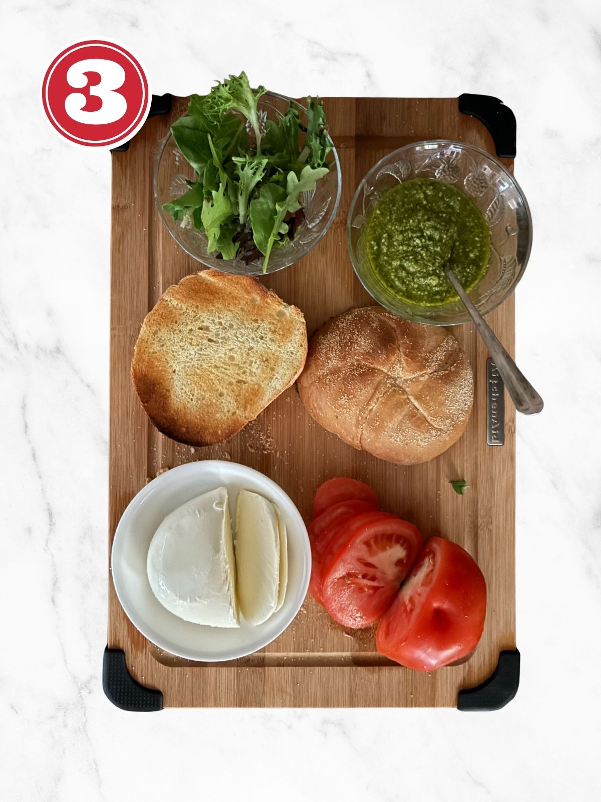 caprese chicken ingredients on a cutting board