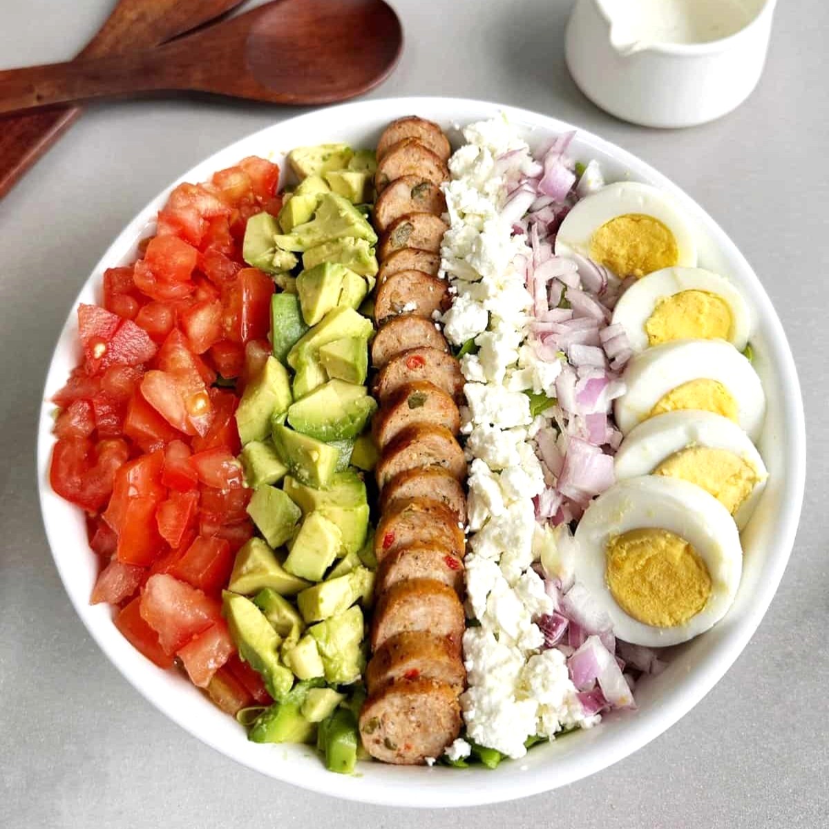 Sausage Cobb Salad in a white bowl