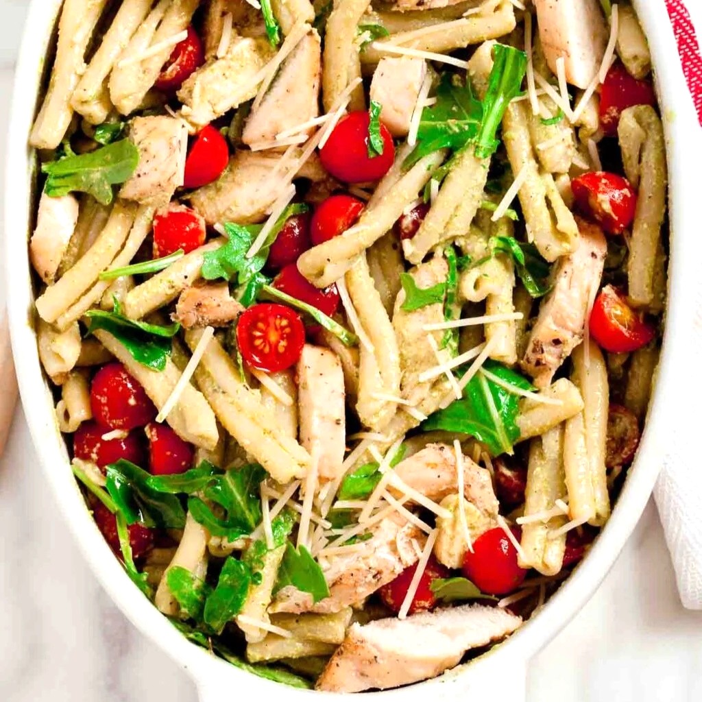chicken pesto salad in a white bowl