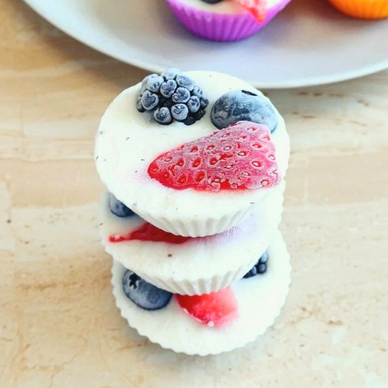 mixed berry frozen yogurt bites on a counter