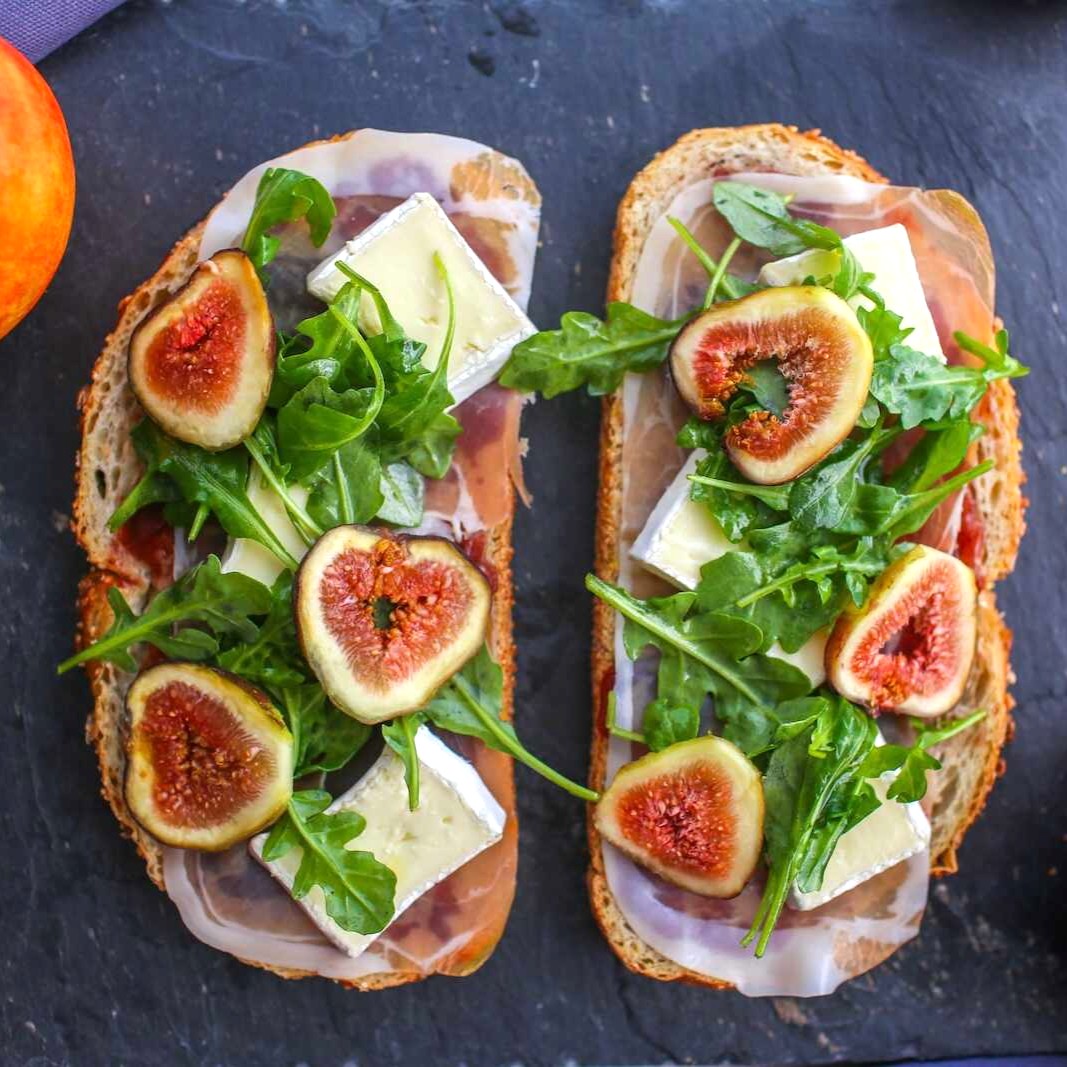 Fig, Prosciutto and Brie Open Faced Sandwich on a slate counter